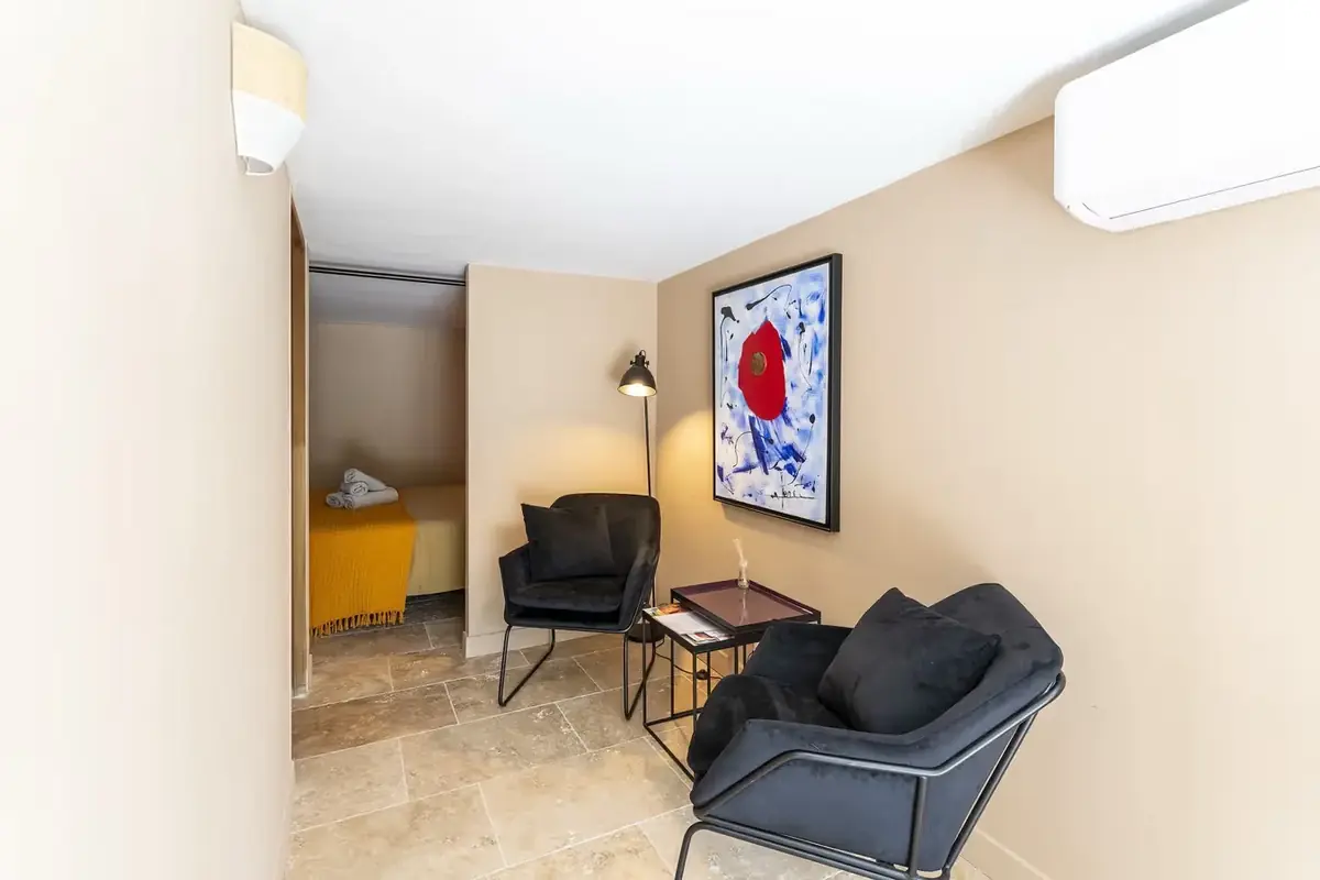 Air-conditioned sitting area with armchairs