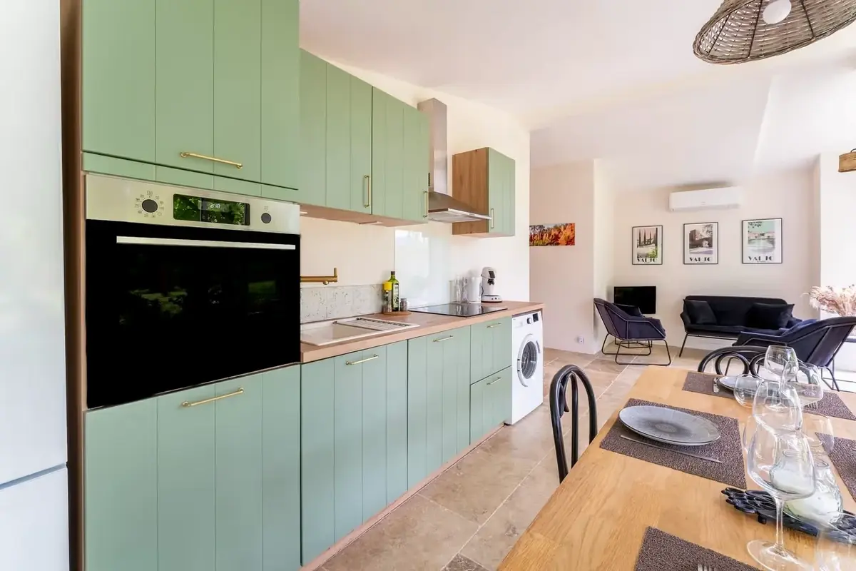 Fully equipped kitchen opening onto the living room