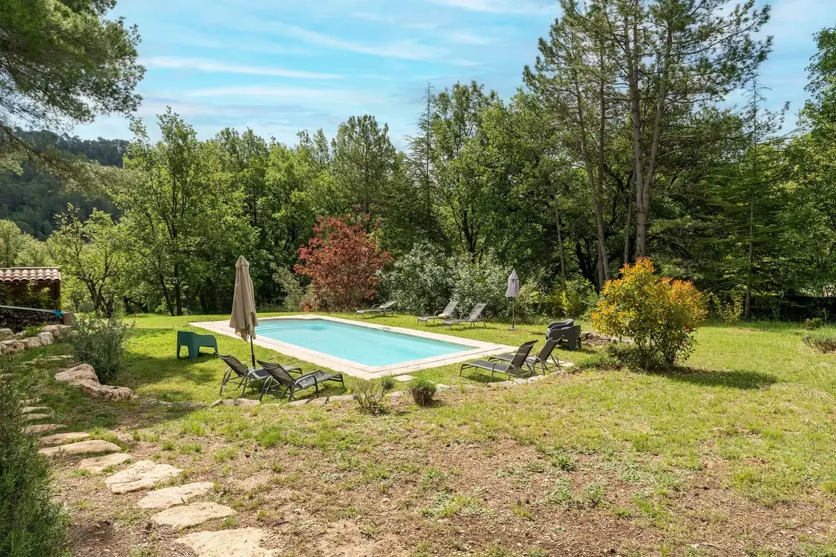 The estate pool surrounded by nature