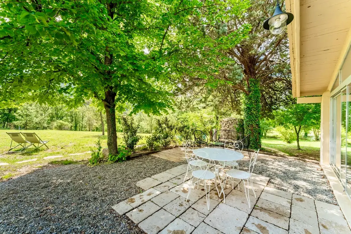 Shaded terrace under the tall trees
